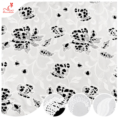 Vente à chaud Tissu brodé blanc fleuri doux et creux à l'oeil Tissu brodé polyester